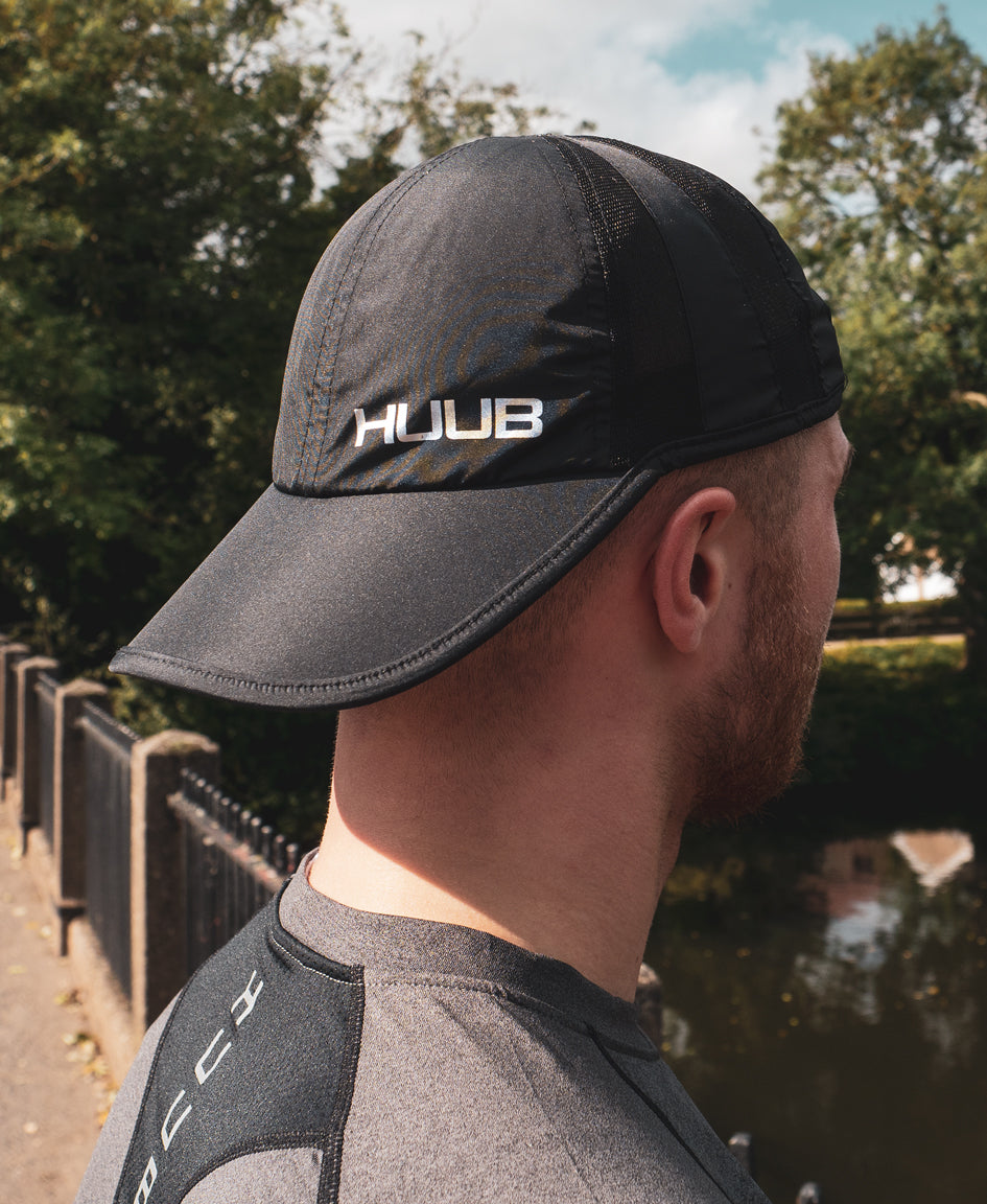 HUUB Race Cap II – mesh, flat panel, race running cap in Coral, White, or Black, ultra-lightweight and adjustable.