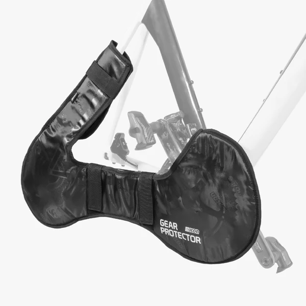 Scicon bicycle brake lever and gearbox protector attached to a mountain bike handlebar, showcasing durable cycling components.